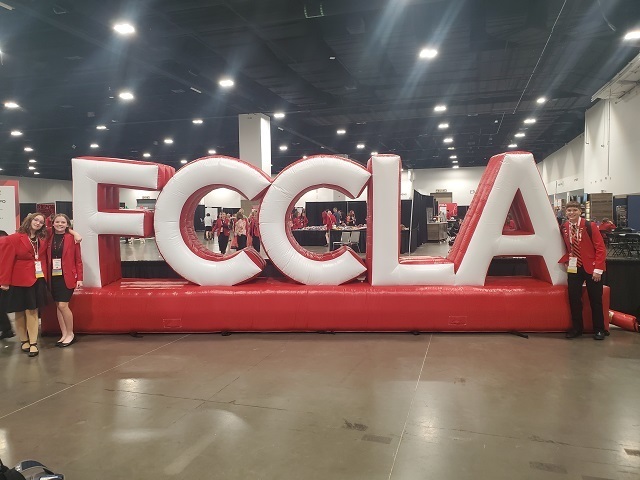 WMS students standing in front of inflatable FCCLA sign
