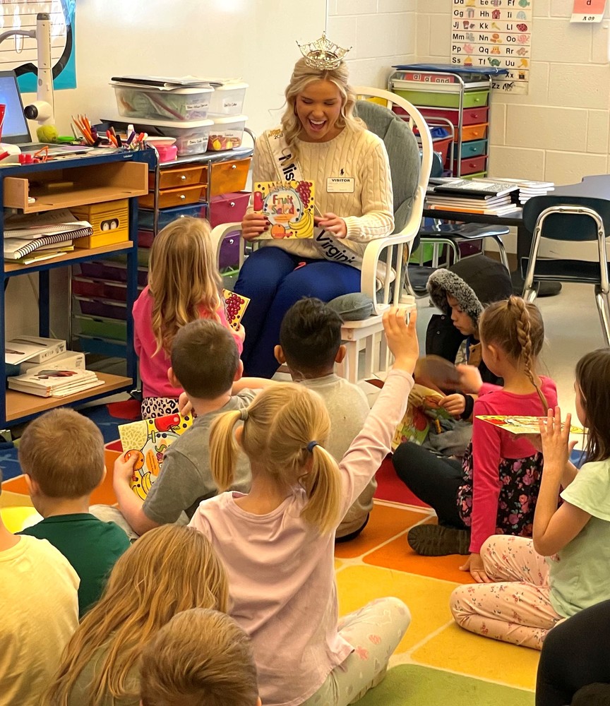 Miss WV reading to students in classroom