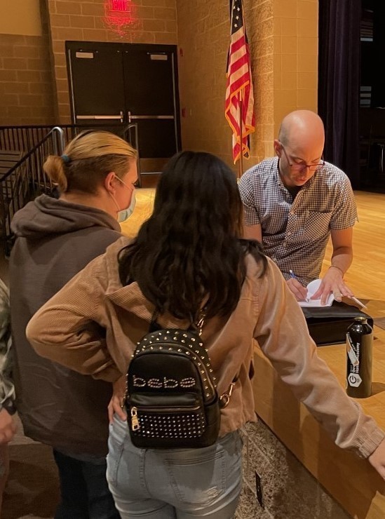 Man with students