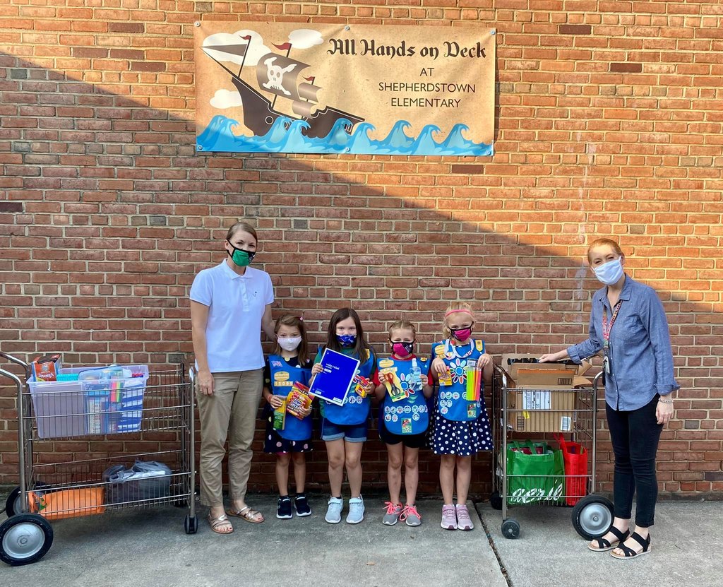 Girl Scouts with donated school supplies