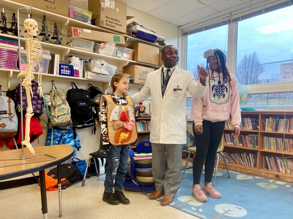 Dr. Cholet Josue, physician and neuroscientist engaging in a learning activity with students