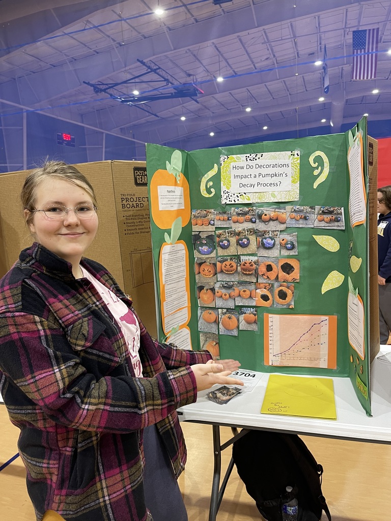 Student with science fair project