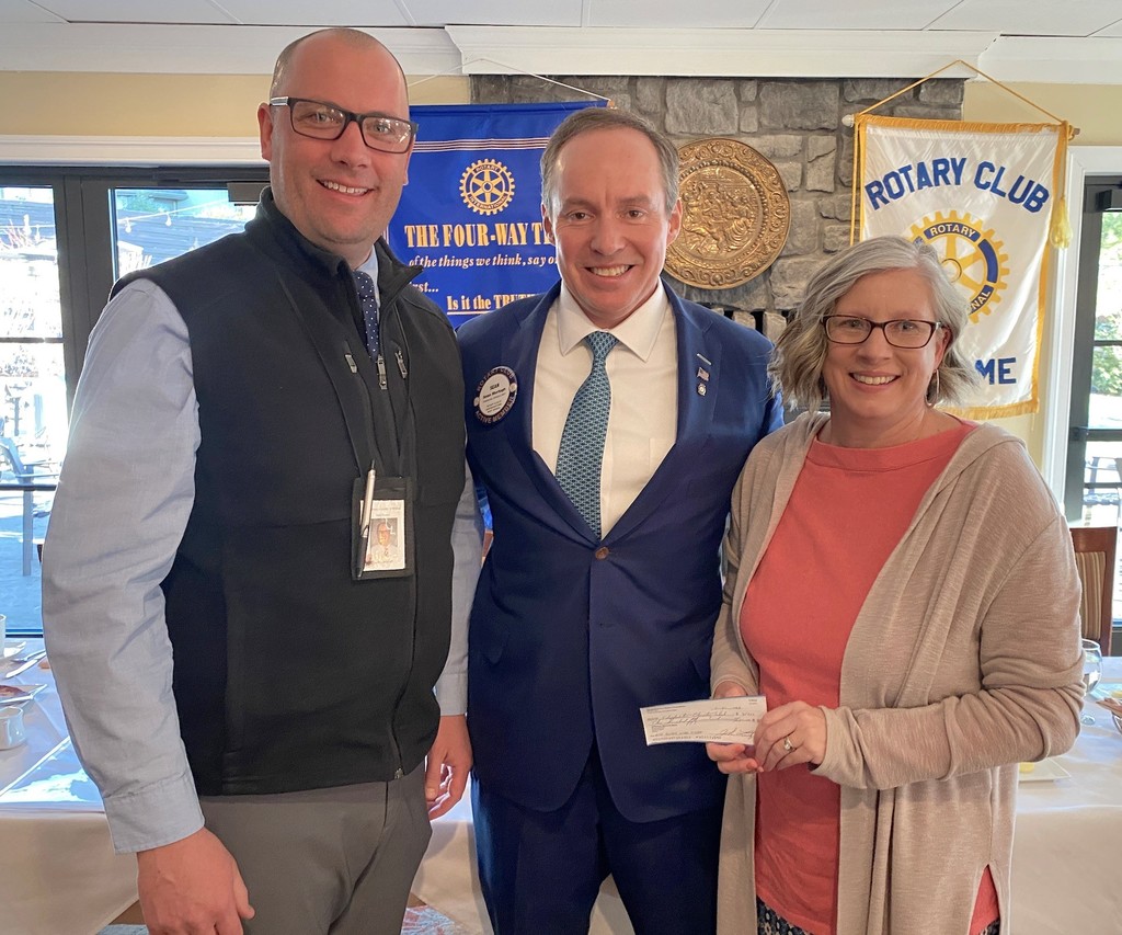 Mr. Campbell, left, with Rotary Club President Sean Murtagh, center, and Ms. Webb, right. 