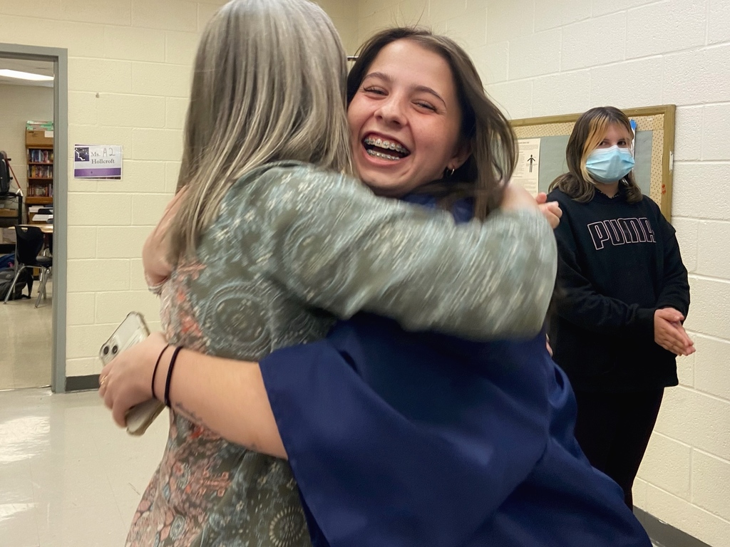 WHS senior hugging a former teacher