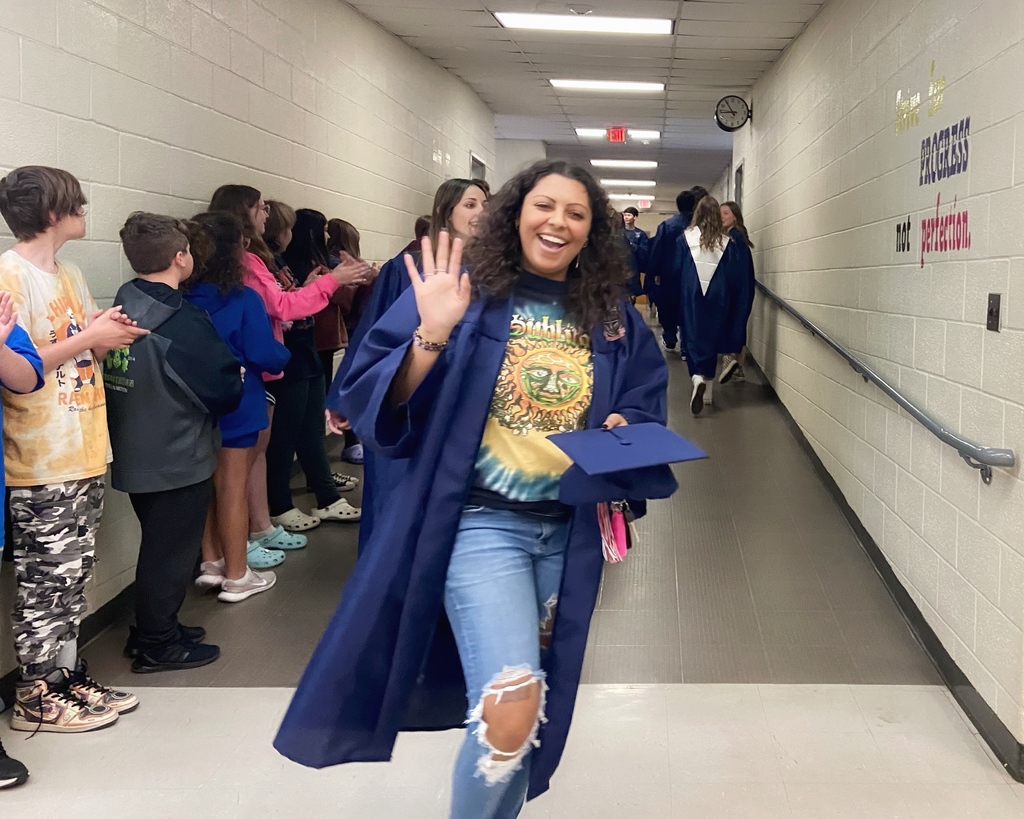 WHS senior waving as she walks through CTMS halls