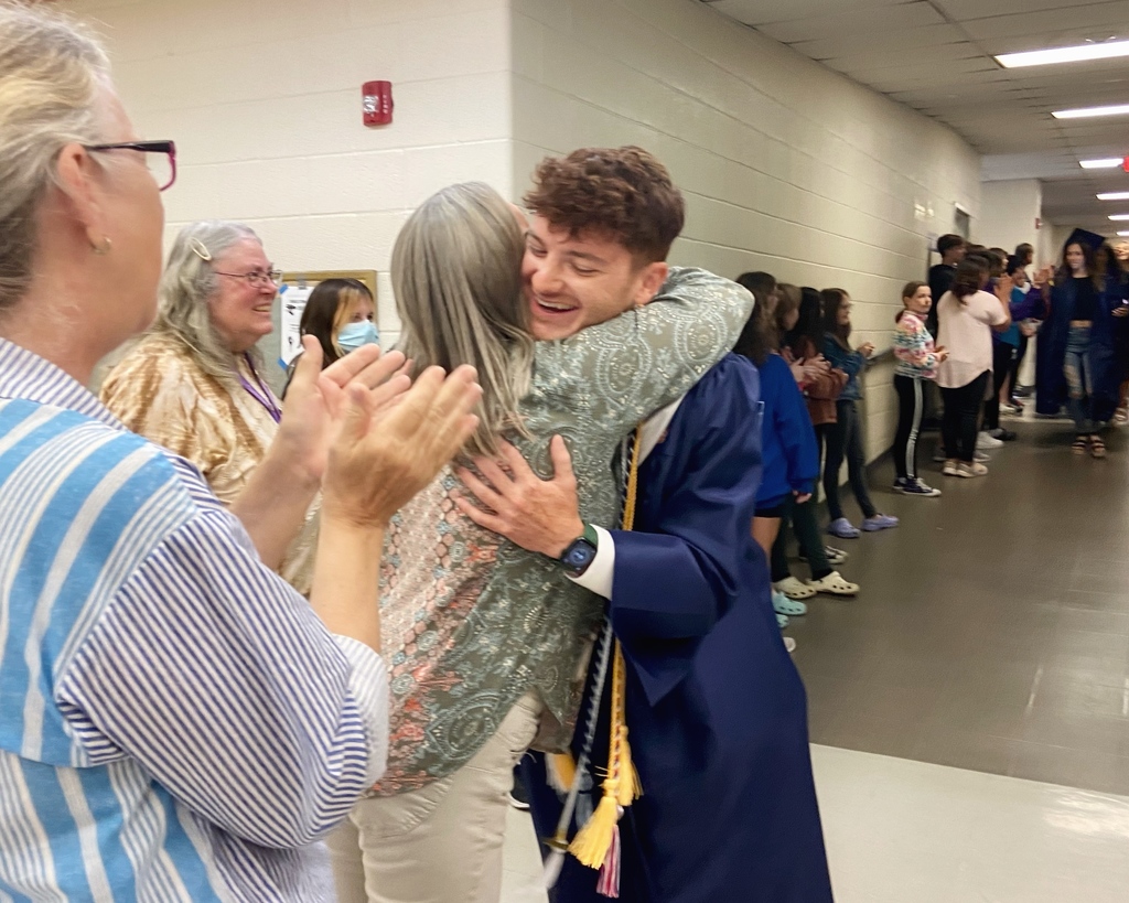WHS senior hugs former teacher