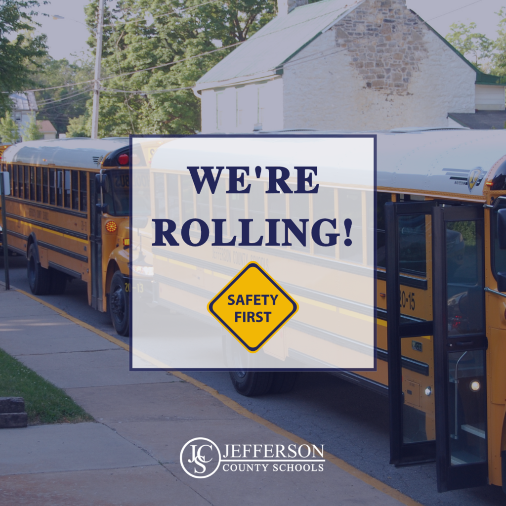 "We're rolling!" message over image of school buses