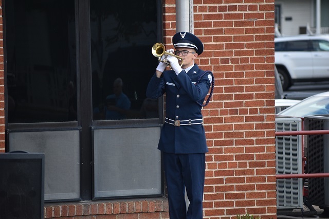 JROTC cadet plays Taps on trumpet