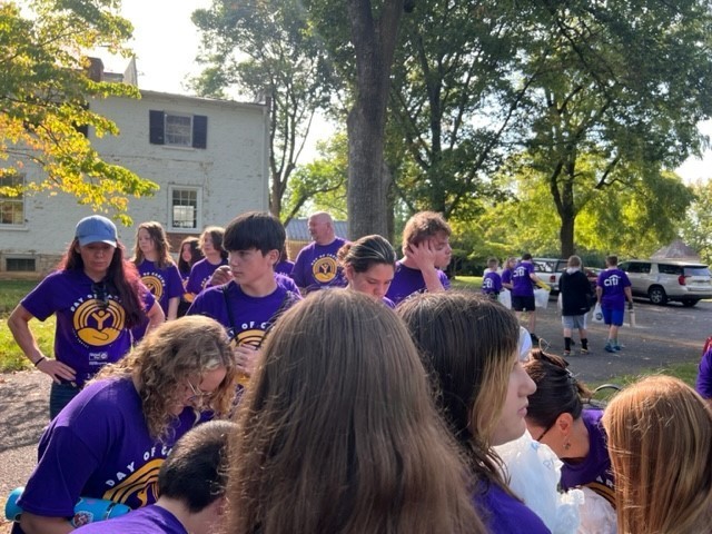 students getting cleaning supplies