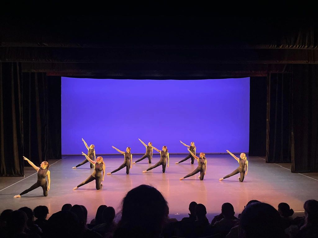 Washington High School's Synergy Dance Ensemble performing on stage at Arts Ed